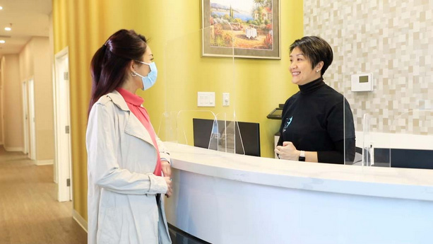 Markham Dental staff with patients.