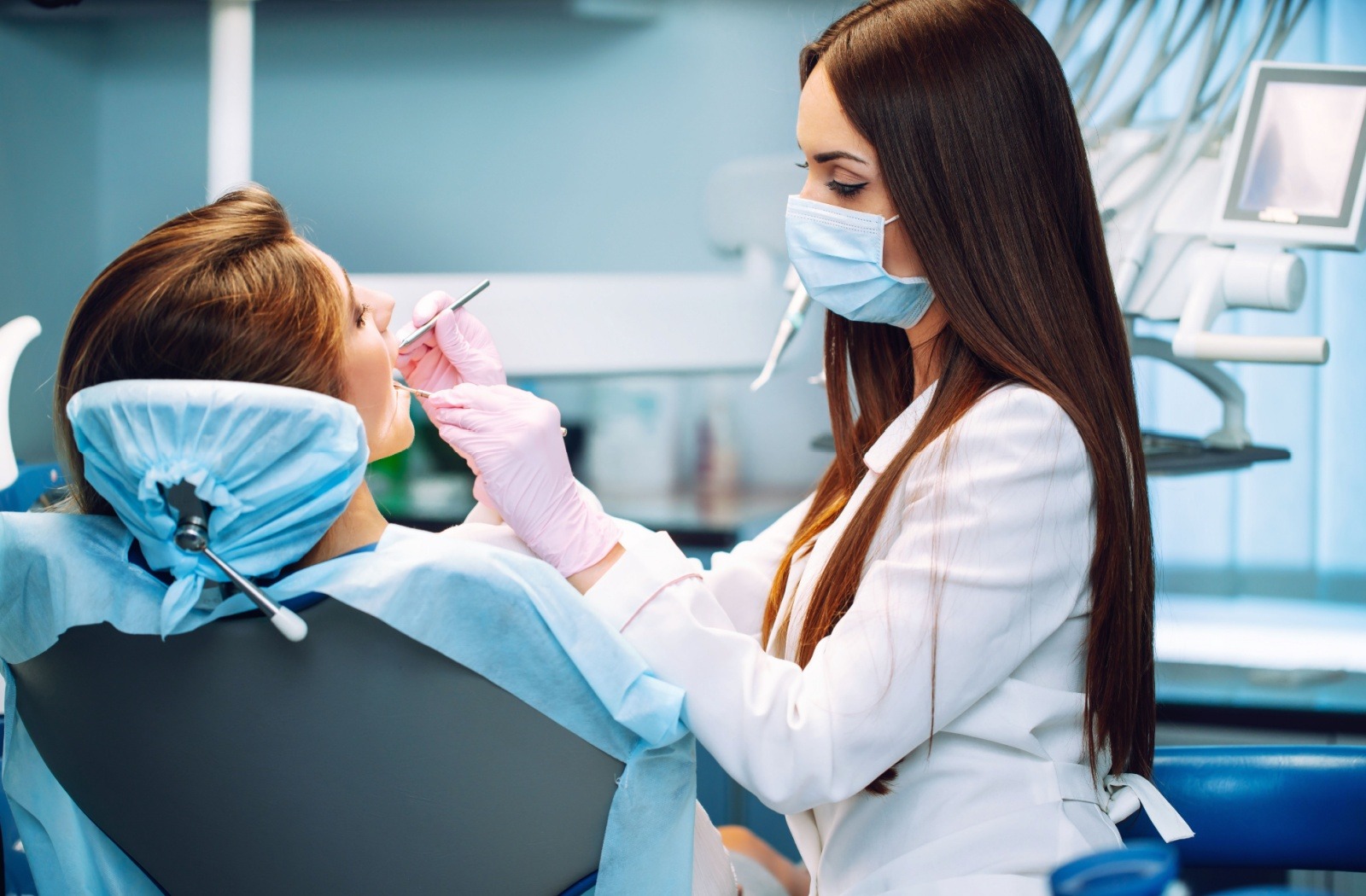 A patient at the dentist having their teeth cleaned.