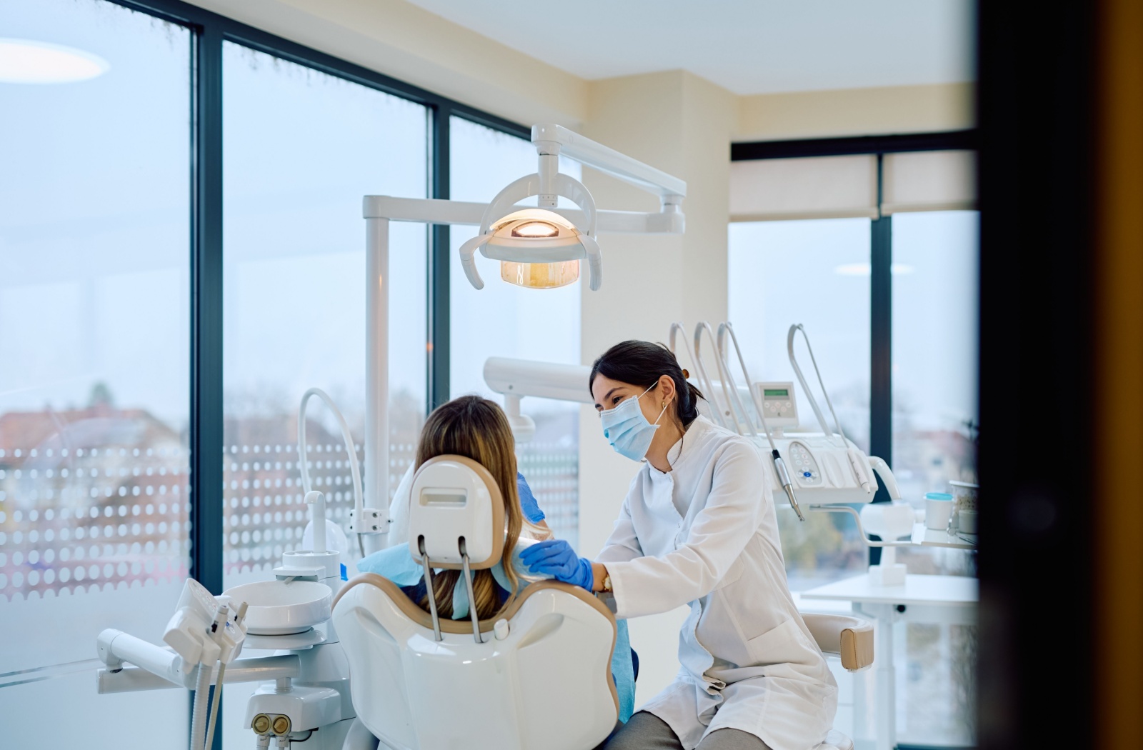A dentist in Markham doing an exam on a patient's teeth.
